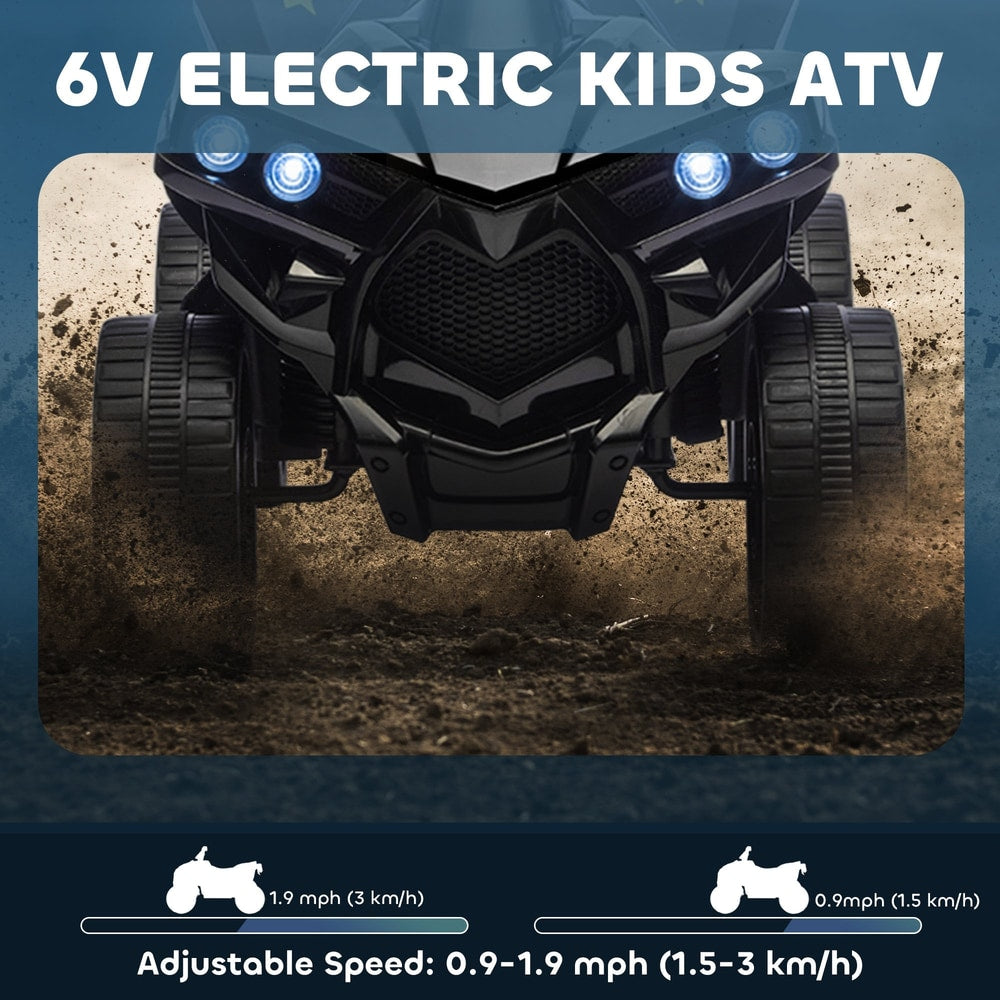 Close up of the front of the black kids electric quad bike on a dirt track