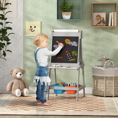 A young child drawing on the double-sided art easel with a paper roll attachment in a bright room