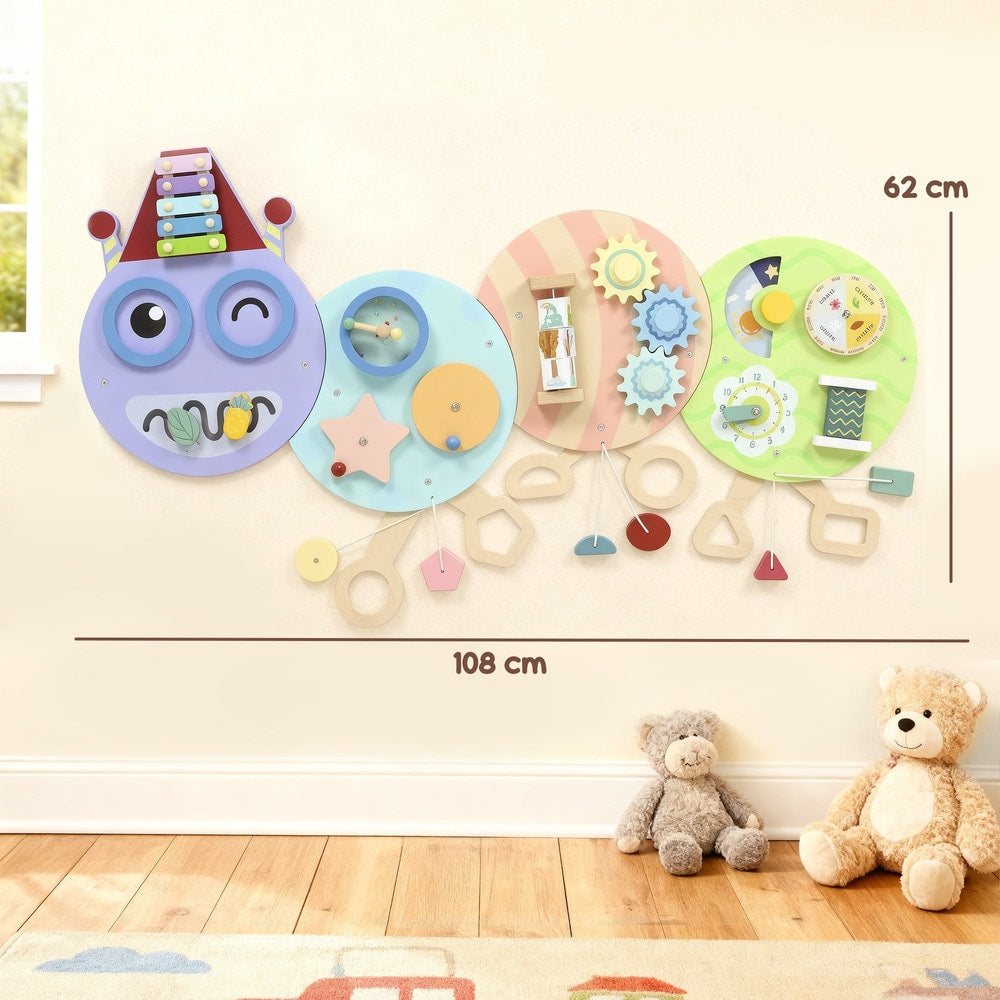 The caterpillar busy board mounted on a wall with dimensions shown