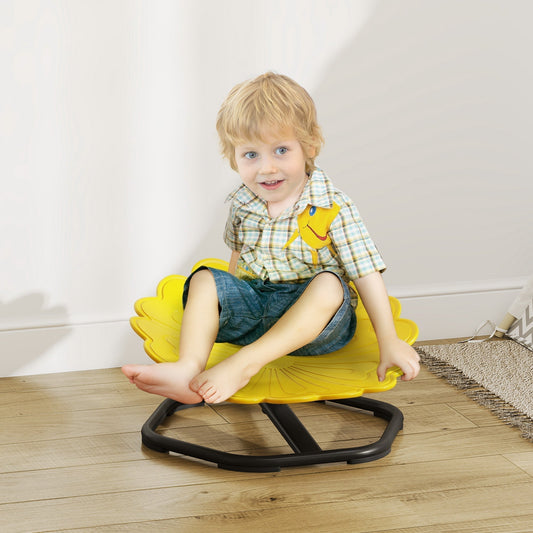 A young boy sitting on the yellow spinning chair in a bright room