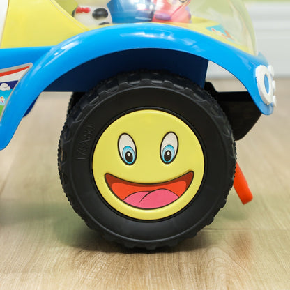 Close up of the wheel with a smiley face on the blue toddler ride on car