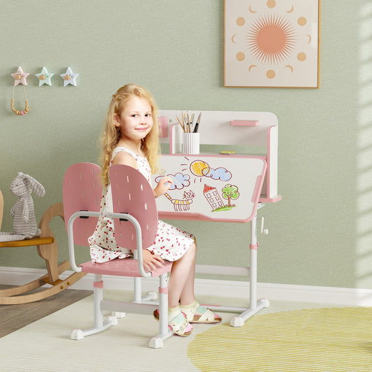 Child sitting at the pink kids study desk and chair set, drawing at the desk
