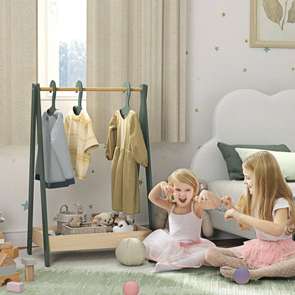 The green kids clothes rail with 3 hangers and bottom storage shelf in a nursery with two young girls playing