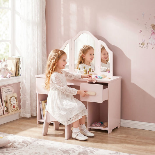 A young girl playing at the pink dressing table with a stool and mirror