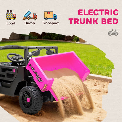 The kids electric UTV with its rear dump bed tilted to empty a load of sand