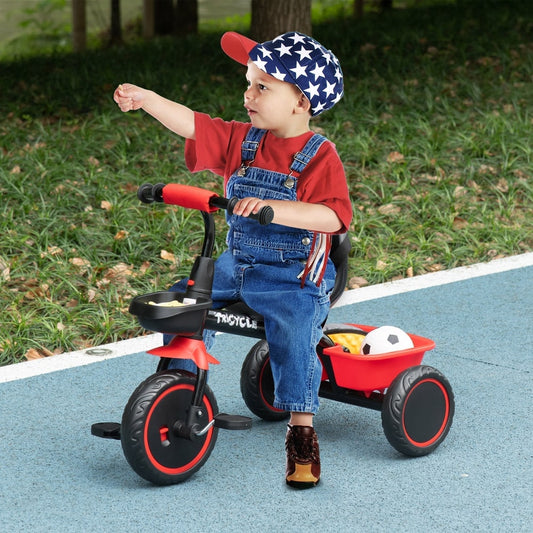 A young child in dungarees riding the red kids trike on a blue path in a park