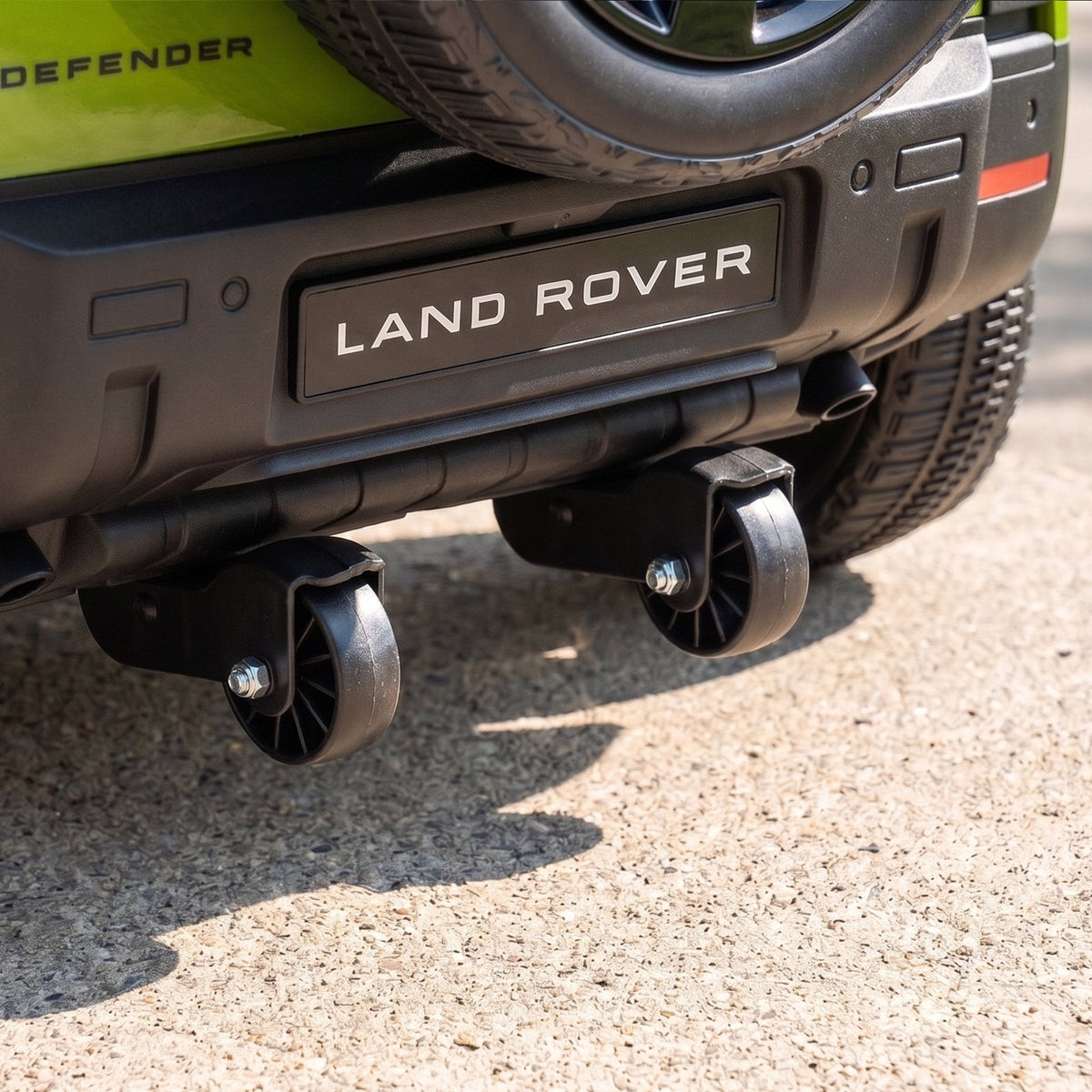 Close-up of the rear underside of the ride-on car showing the small transport wheels