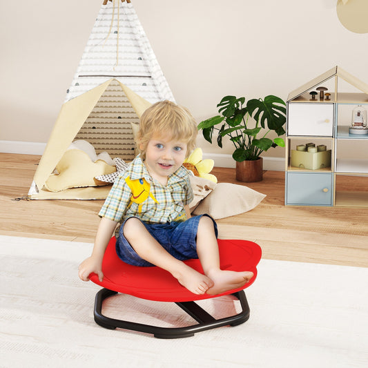 A young boy sits on the red planet-shaped kids swivel chair in a playroom