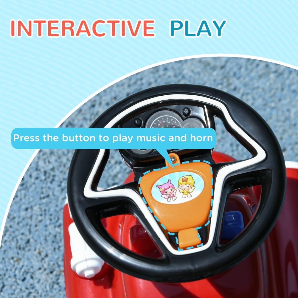 Close-up of the black steering wheel with a central orange button for music and horn