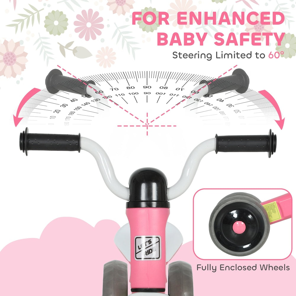 Close-up of the handlebars and front wheel of the pink toddler balance bike with no pedals