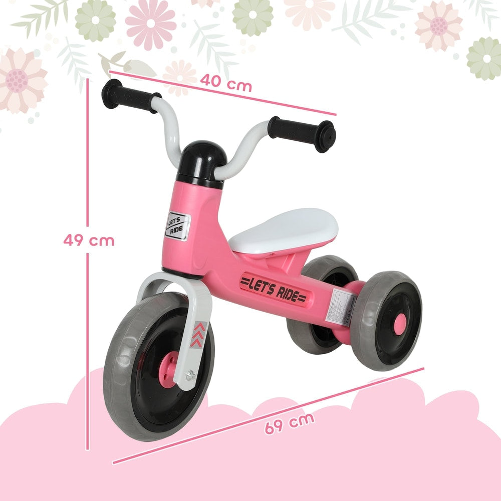 The pink toddler balance bike with no pedals shown with dimensions marked for height and length