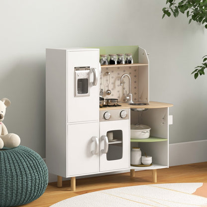 The kids play kitchen is shown in a room setting with a teddy bear and a pouffe
