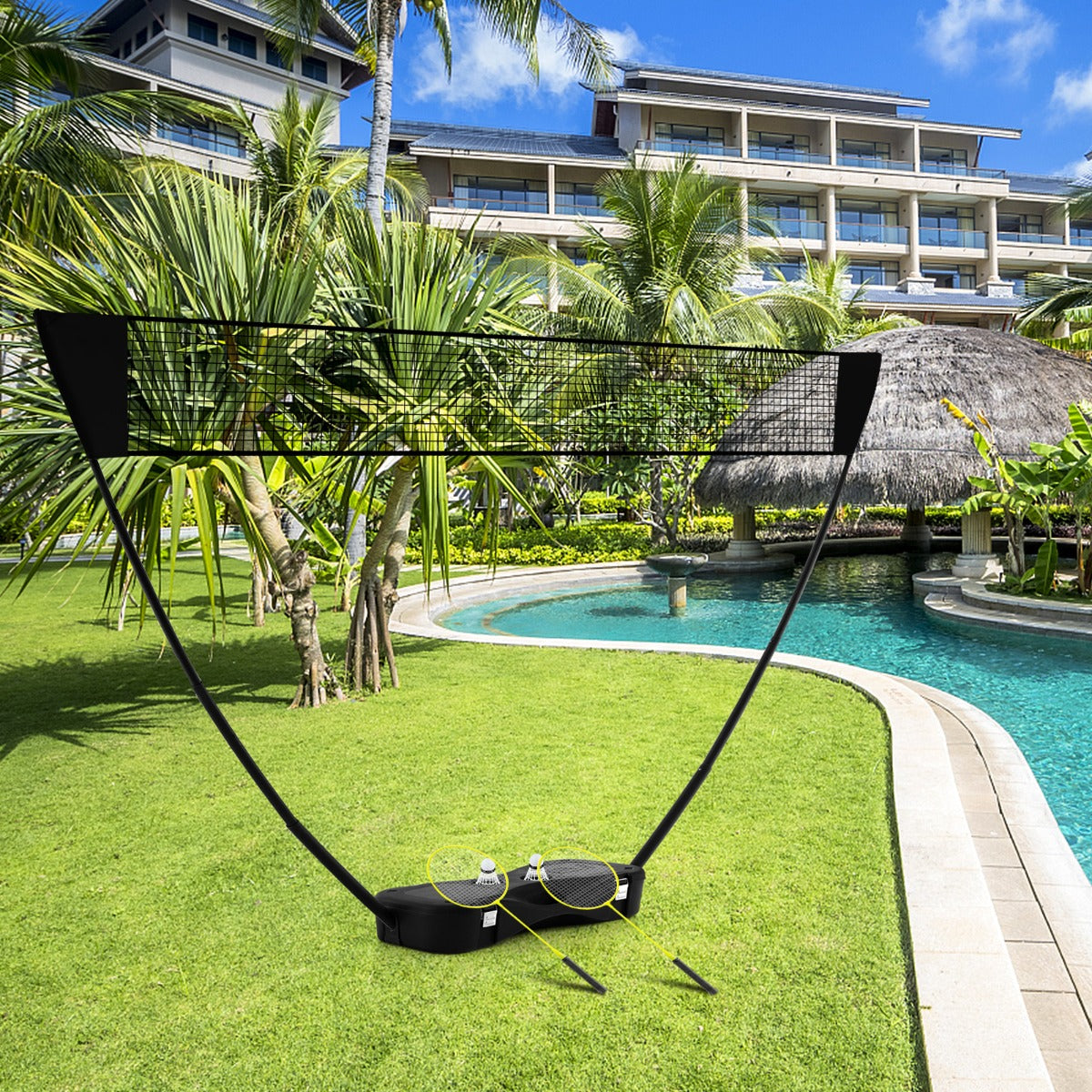 The sport equipment set packed away in its base, sitting on grass near a resort pool