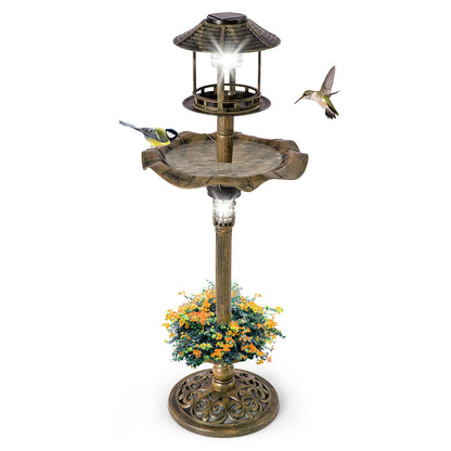 A close-up of the antique birdbath and feeder combo with birds and flowers
