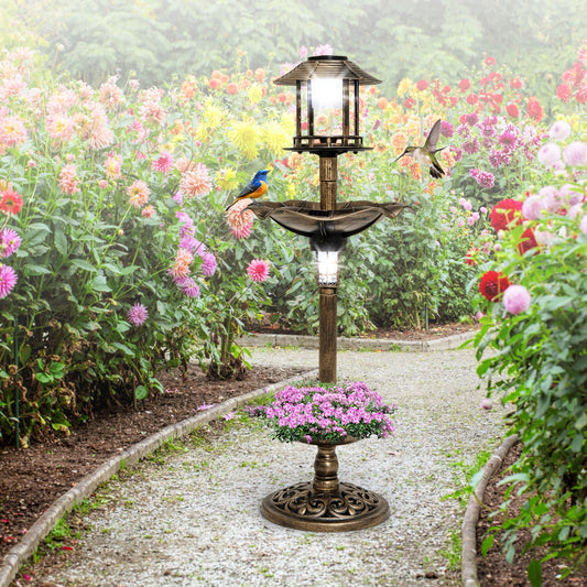 The antique birdbath and feeder combo is shown in a garden setting with flowers and a path