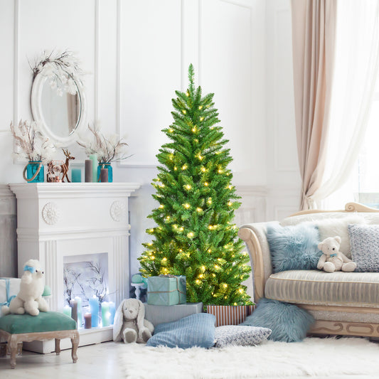 The artificial pencil Christmas tree decorated with lights in a cosy living room setting