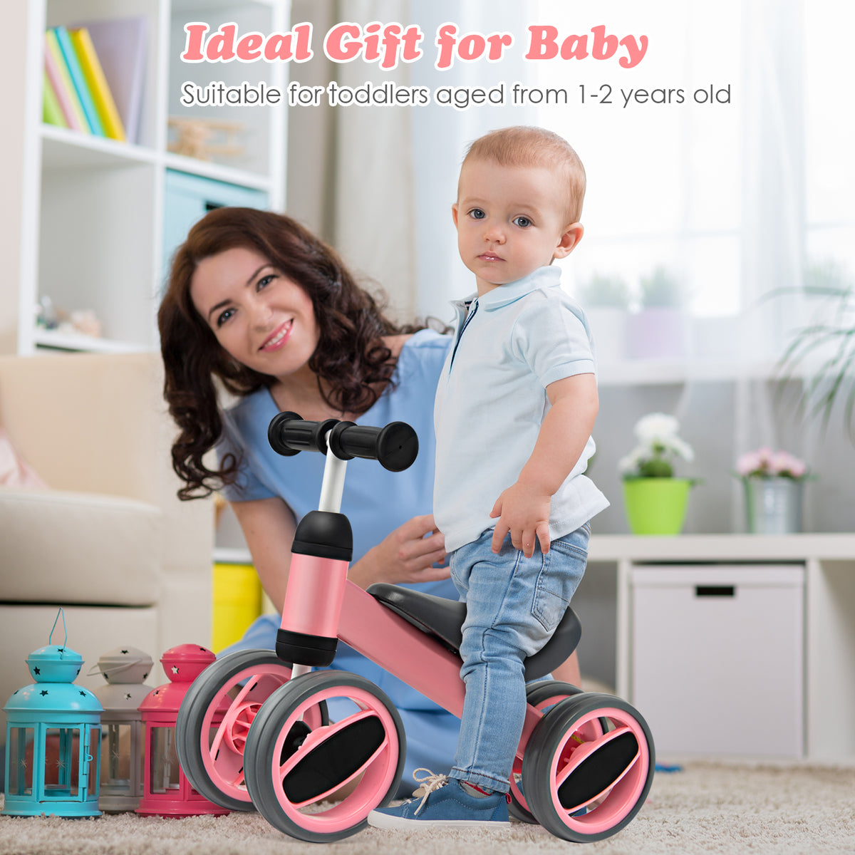 The balance bike standing in a living room next to a toddler and a woman