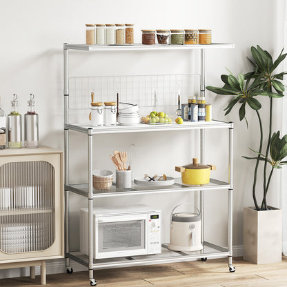 The silver bakers rack on wheels, fully assembled and holding kitchenware and food items