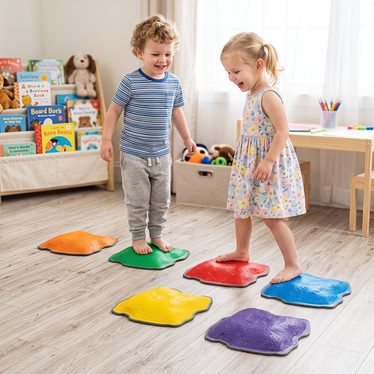 Two children balancing on stepping stones on a wooden floor
