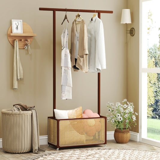 The bamboo clothes rack with hanging clothes and accessories in a bedroom setting