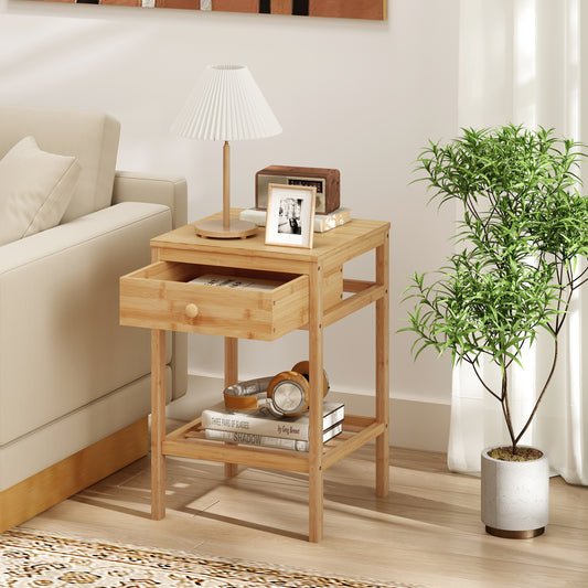 The nightstand placed beside a sofa with the drawer pulled open and a lamp on top