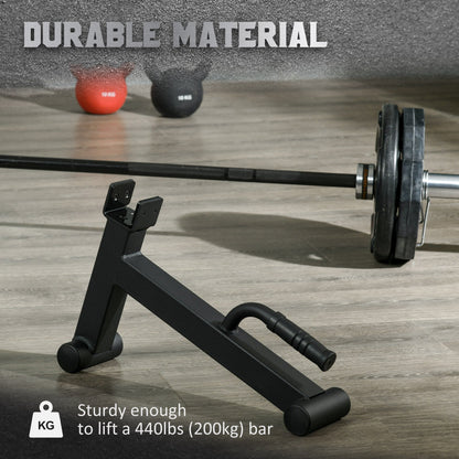 The black metal lifting stand placed on a gym floor next to a barbell