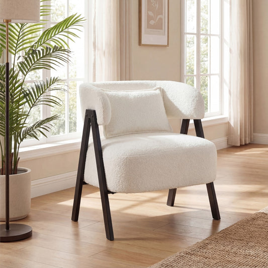 The white upholstered armchair with lumbar pillow placed in a bright living room setting