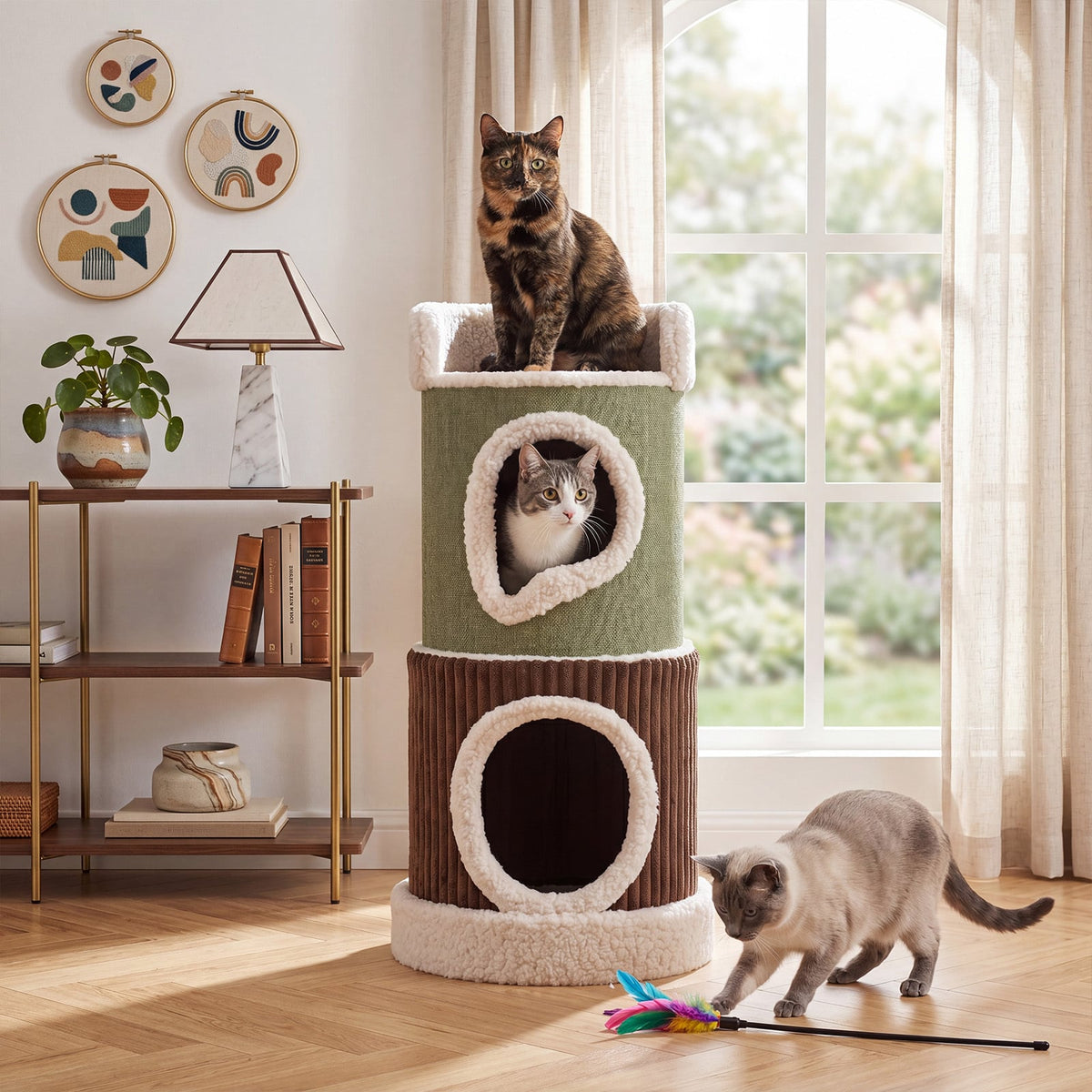 The barrel cat house with cats playing on and around it