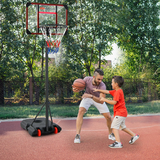 A father and son playing basketball with the hoop and goal set outdoors