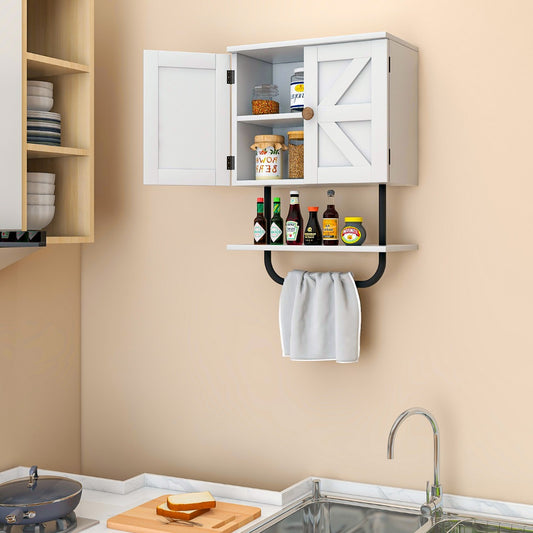 The white bathroom cabinet with its doors open, showing items stored inside