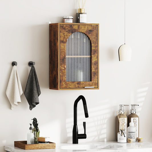 The wall cabinet mounted above a bathroom sink with towels hanging on the wall nearby