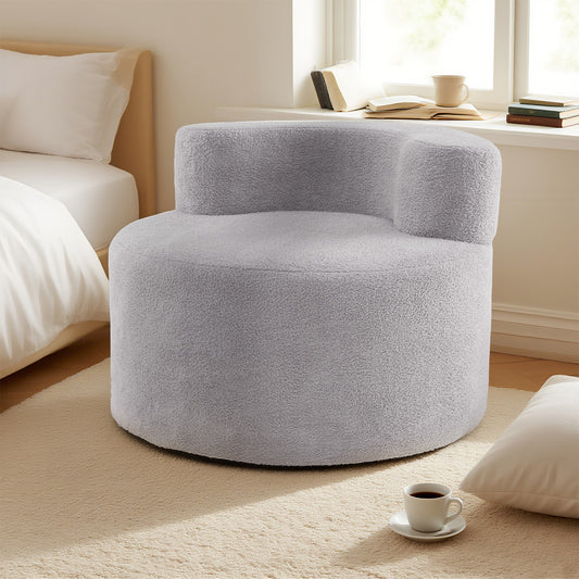 Grey teddy fleece bean bag chair in a bedroom setting next to a bed