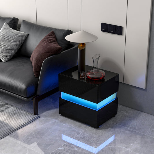 Black bedside table with blue LED lighting next to a sofa in a living room