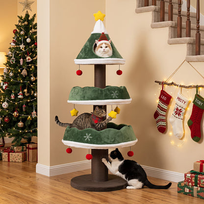 The cat tree placed near a decorated Christmas tree and hanging stockings