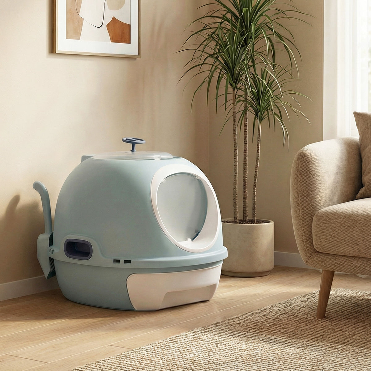 The blue helicopter style cat litter box with lid sits on a wooden floor next to a potted plant