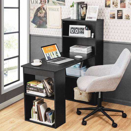The office desk set up in a home study with a laptop and a grey chair