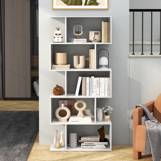 The white geometric S-shaped bookcase is shown in a living room setting with books and decor on its shelves