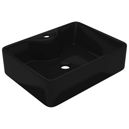 The bathroom basin shown from a high angle to reveal the interior and faucet hole
