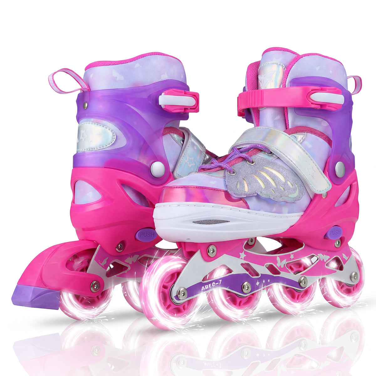 Close up of pink and purple children roller blades with illuminated wheels