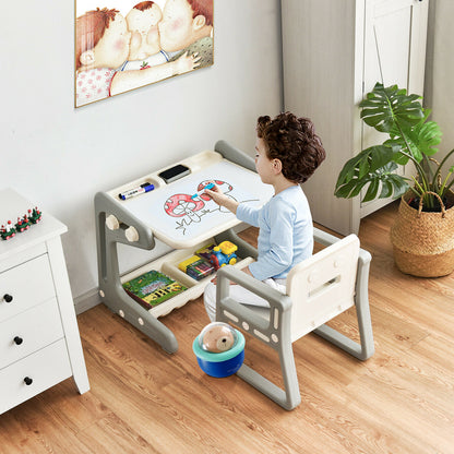 A young boy draws on the art easel table and chair set in a room