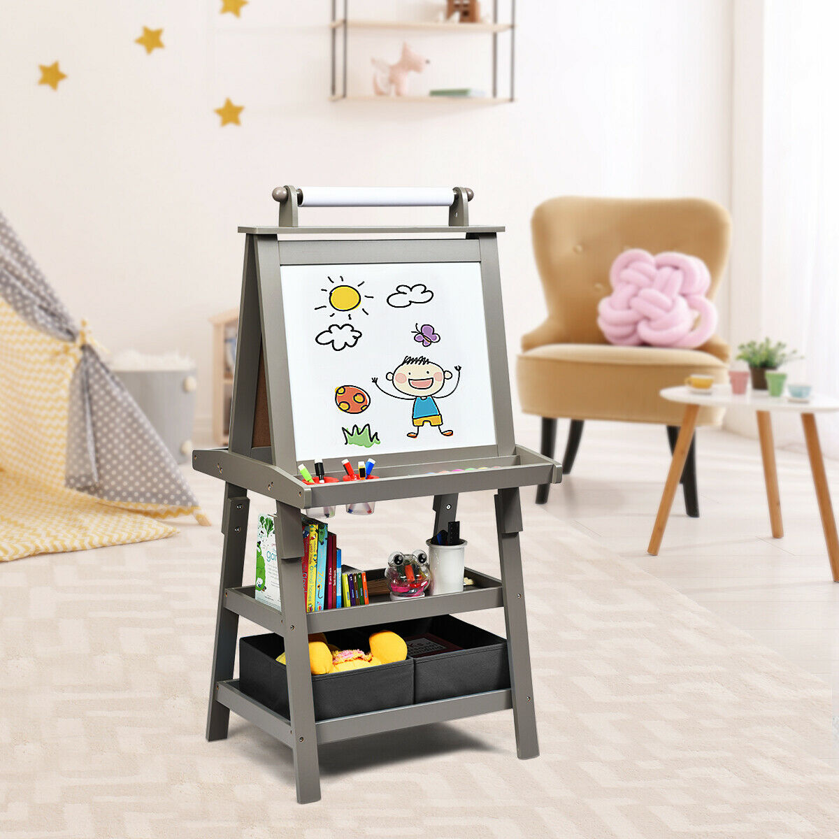 The art easel standing in a child's bedroom with a chair and soft furnishings nearby