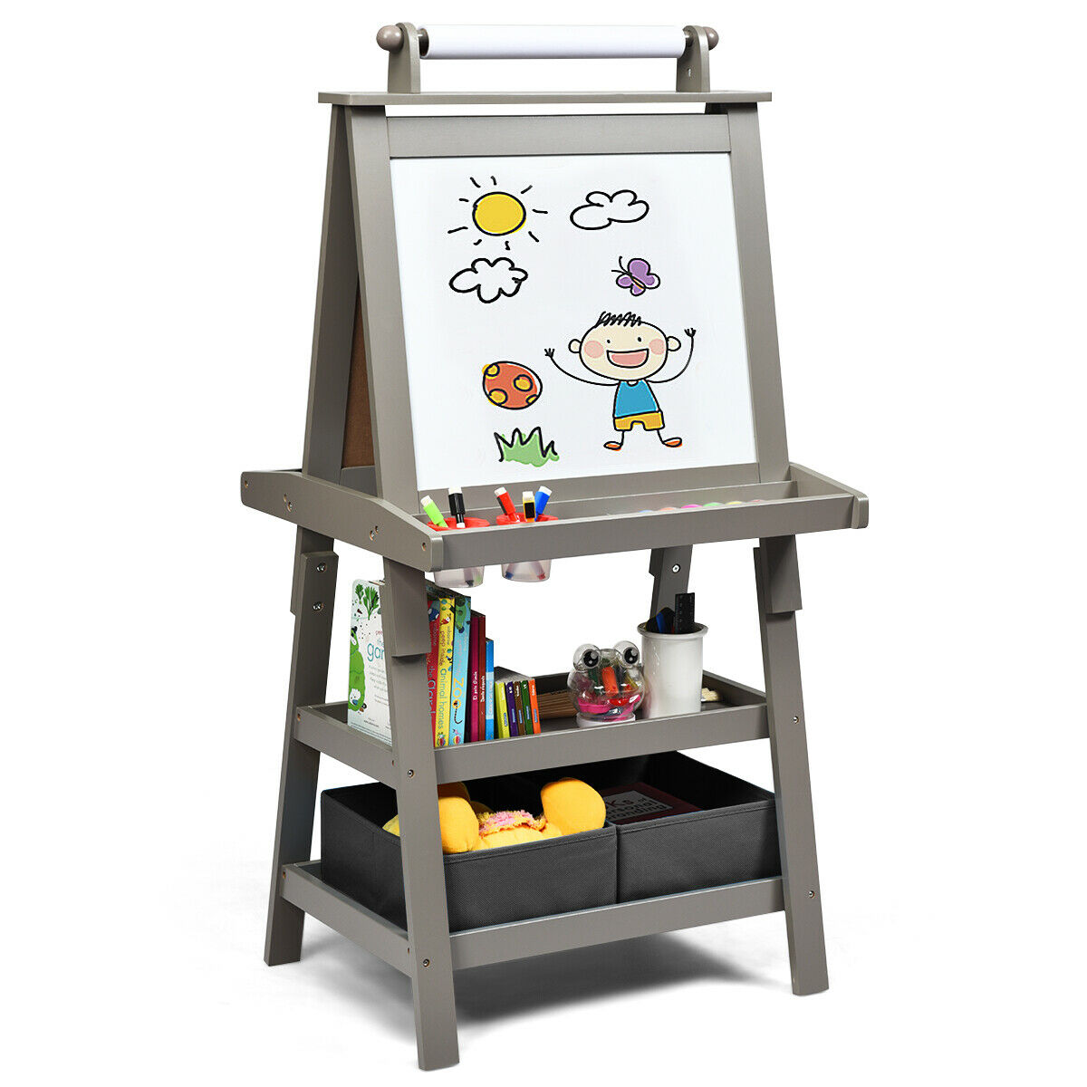 The art easel showing the whiteboard side with storage shelves and fabric boxes below