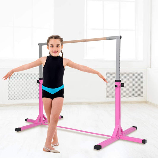 The gymnastics bar standing in a bright room with a young girl posing beside it
