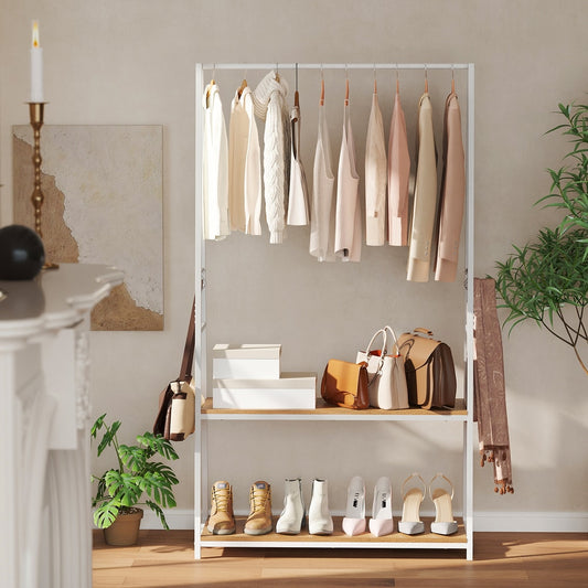 The coat rack with two shelves, styled with clothes, shoes and bags in a bedroom setting