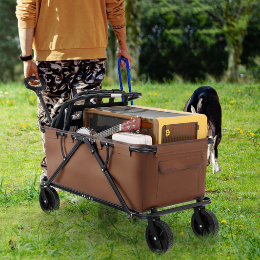 The garden cart being pulled by a person walking through a grassy park with a dog