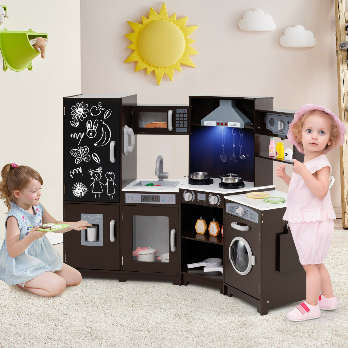 Two children playing with the corner play kitchen set in a room