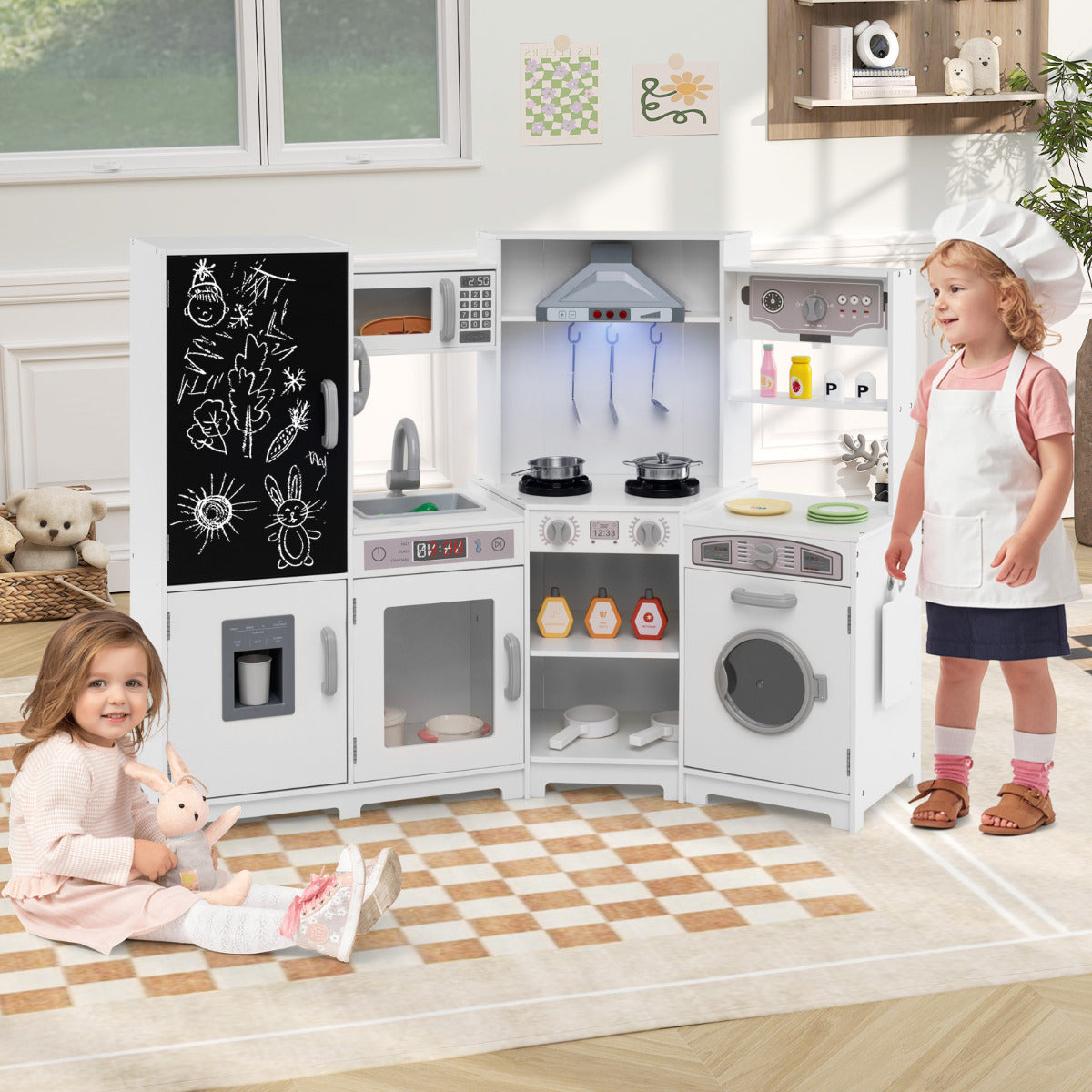 The play kitchen set in a bright room with two children playing with the toy accessories