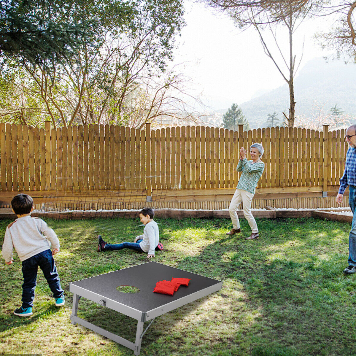 Grandparents playing the lawn game in a garden