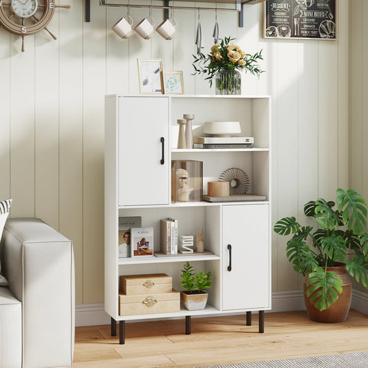 The white storage cabinet with metal legs placed in a living room next to a sofa