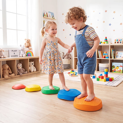Children balancing on the toy sports stepping stones in a playroom